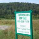 A land for sale sign stands in front of growing corn on Route 2 in East Montpelier. VTD/Josh Larkin