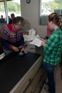 Mac's Market employees tally a customer's groceries by hand. VTD/Josh Larkin