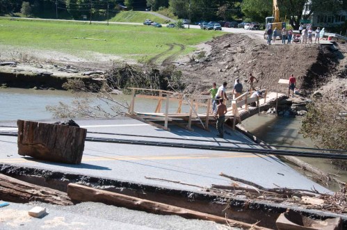 Workers constructed a small foot bridge across the White River at the junction of Routes 73 and 100 to connect the east and west sides of Rochester. VTD/Josh Larkin