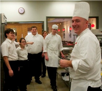 Chef David Hale meets with his students before the lunch hour at The Hilltopper, the restaurant run by the culinary arts program of St. Johnsbury Academy. Photo by Dirk Van Susteren 