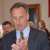 Gov. Peter Shumlin holds the pen as he prepares to sign into law a law allowing terminally ill patients the right to obtain a lethal dose of medication. Vermont was the first state to create a physician-assisted death law by legislation as opposed to public referendum. Photo by Alicia Freese/VTDigger