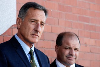 Gov. Peter Shumlin and Lawrence Miller, chief of the state's heath care reform effort, attend a news conference Thursday in Barre to announce a grant to repair flood damage in the city. Photo by John Herrick/VTDigger