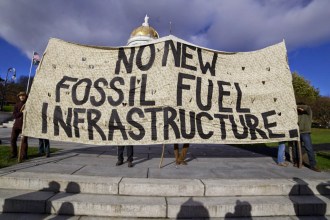 Demonstrators protest the Vermont Gas pipeline at the Statehouse in Montpelier. Photo by John Herrick/VTDigger