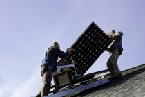 Electricians install the last solar panels at the home of SunCommon’s 1,000th customer in Barre Town on Tuesday. Photo by John Herrick/VTDigger