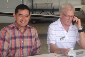 Ary Quiros (left) and Bill Stenger attend a news conference on improvements at Newport State Airport in Coventry. Photo by Anne Galloway/VTDigger