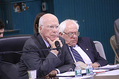 Sen. Patrick Leahy and Sen. Bernie Sanders listen to testimony at the Senate Judiciary Committee hearing on antitrust issues in the dairy industry on Saturday in St. Albans. Photo by Terry J. Allen.