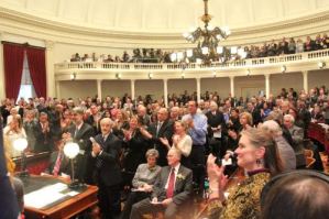 Douglas and Salmon sit out applause for health care reform. Photo by Terry J. Allen.