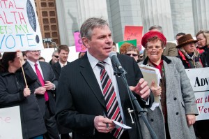 20110309--healthRally-8 Floyd Nease put forth the rally slogan "No axes - raise taxes!" Photo by Josh Larkin.