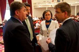 Party leaders Don Turner, Chris Pearson and Lucy Leriche meeting with Speaker Shap Smith at the podium. VTD/Josh Larkin