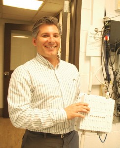 Al Levy, president of Summit Technologies, shows off a wireless repeater. VTD/Andrew Nemethy