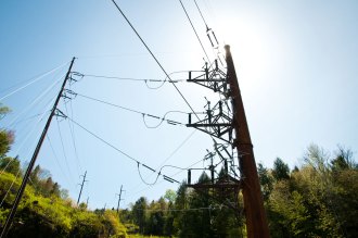 Power lines cut across a Vermont hillside. Photo by Josh Larkin/VTDigger