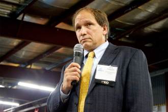 Dave Hallquist, CEO of Vermont Electric Coop, listens to a member comment about the proposed transmissions upgrade. VTD/Taylor Dobbs