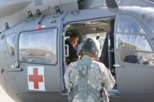 Gov. Peter Shumlin gets strapped in for a fly over of the state. VTD/Josh Larkin