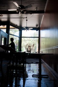 A worker clears away tables and chairs in The Alchemist. VTD/Josh Larkin