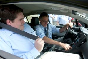 Rep. Oliver Olsen, left, goes on a test drive of a Chevy Volt with Gov. Peter Shumlin at the wheel at the Grand Opening of Green Mountain Energy in South Londonderry Vermont. Photo courtesy of Fran Janik.