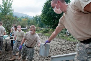 Norwich cadets remove items from a flooded home in Northfield. VTD/Josh Larkin