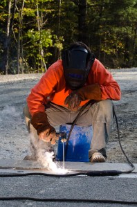 District 9 VTrans employee Mark Blais welds a seam on a bridge on Route 100 in Pittsfield. VTD/Josh Larkin
