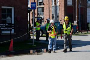 Workers outside the Old Carpenter Shop at the state office complex in Waterbury. VTD/Josh Larkin