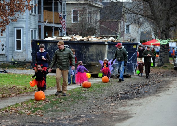 Families trick-or-treat along Randall Street in Waterbury. Photo by Gordon Miller.