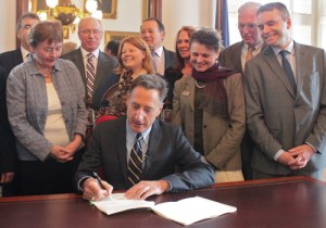 Gov. Peter Shumlin signs H.440. Photo by Taylor Dobbs