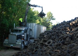 BDS removes tires at Rhoades Salvage on Wednesday. Photo by Audrey Clark