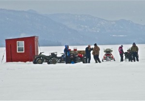 On a cold day in early March, fishermen hang near a shanty to discuss the day’s catch on Lake Memphremagog, just off Newport. Photo by Dirk Van Susteren
