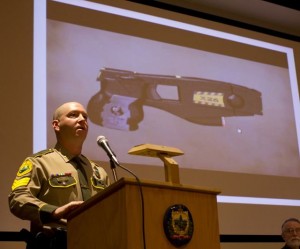 Sgt. Hugh O'Donnell, a state trooper and taser instructor for the state police, discusses the basic of taser use and training at a Montpelier public forum on March 11, 2013. Photo by Nat Rudarakanchana