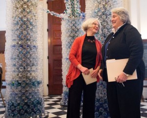 UVM Art Department faculty member Beth Haggart (left) talks with Sen. Ginny Lyon in front of a sculpture Haggart designed and built made from 3,000 empty bottled water bottles. The sculpture was the centerpiece of a press conference held Wed., March 20.  Photo by Andy Duback for UVM