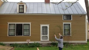 “Rokeby Museum director Jane Williamson shows a visitor a wing of the Rokeby farmhouse in Ferrisburgh where escaped slaves lived while working on the farm. Photo by Candace Page