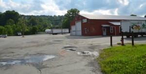 This building will be razed to make way for a parking lot for workers at City Place in Barre. The building and lot are owned by Barre Mayor Thom Lauzon. Photo by Alicia Freese/VTDigger