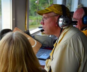 Bear Ridge owner "Butch" Elms watches racing intently from his seat in the tower overlooking the dirt speedway,  which has hosted racing for 46 years on a remote hillside in the town of Bradford. Photo by Andrew Nemethy/VTDigger