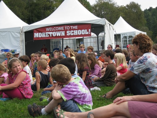 Students gathered in the backyard of the Moretown Elementary School under tents after Tropical Storm Irene flooded the school in 2011. Photo courtesy Moretown Elementary School.