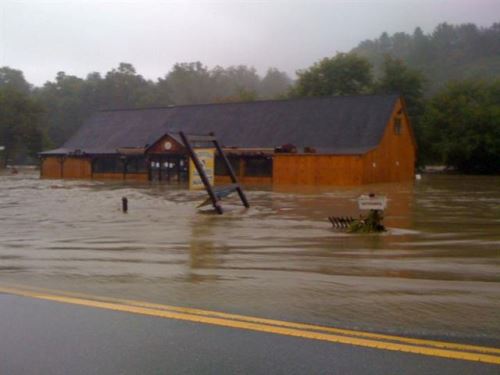 The Woodstock Farmers' Market closed for 11 weeks after flooding from Tropical Storm Irene. Credited for eight weeks of layoffs the business issued, the market's unemployment insurance bill is nonetheless about $30,000 per year higher than it used to be. Photo courtesy Woodstock Farmers' Market.