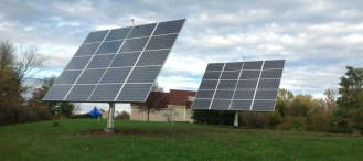 Two AllSun Trackers manufactured by AllEarth Renewables at a home in Alburgh. AllEarth Renewables photo