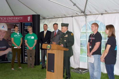 Norwich President Richard Schneider (center) speaks during a send-off news conference outside the Statehouse on Tuesday with Gov. Peter Shumlin and Middlebury President Ronald Liebowitz. Photo by Viola Gad/VTDigger