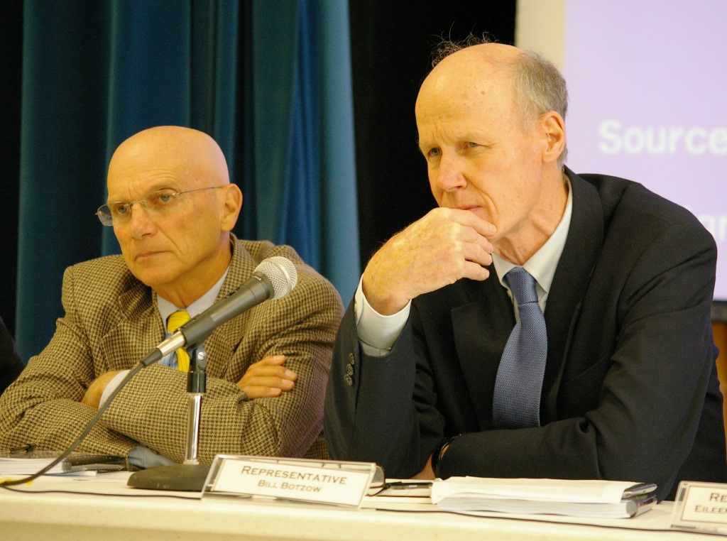 Reps. Tony Klein, chair of the House Natural Resources and Energy Committee, left, and Bill Botzow, chair of the House Committee on Commerce and Economic Development, listen to testimony from Windham County leaders at a joint hearing held in Vernon on Vermont Yankee's closure. Photo by Andrew Stein/VTDigger