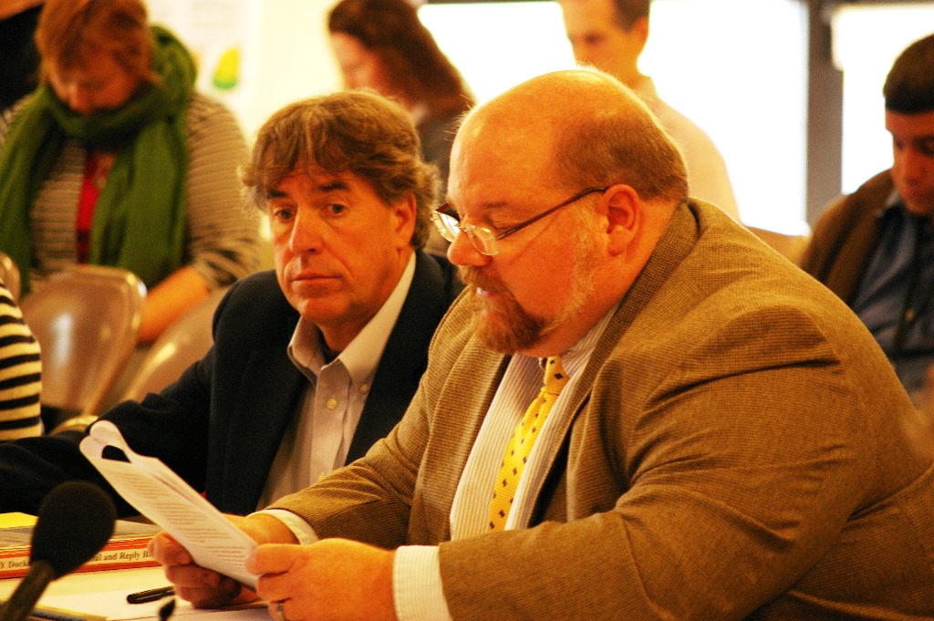 Chris Campany (right), director of the Windham Regional Commission, and Commissioner Tom Buchanan tell legislators that Windham County needs economic help to cushion the blow of Vermont Yankee's closure. Photo by Andrew Stein/VTDigger
