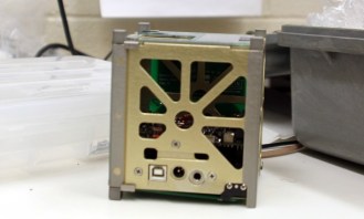 A cube satellite built and programmed at Vermont Technical College measures just 4 inches cubed. Photo by Viola Gad/VTDigger