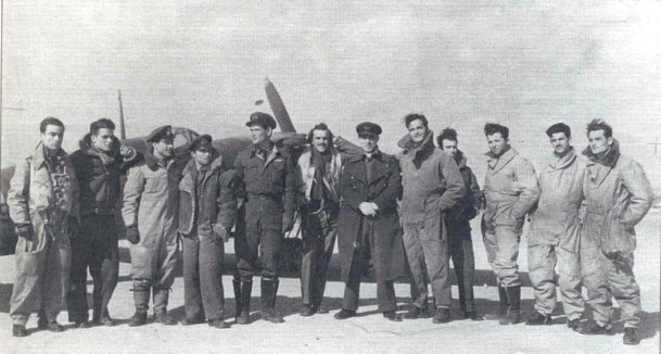 Members of the 336th Royal Hellenic Fighter Squadron, pause in front of a Spitfire at an unknown airfield in North Africa in 1943. The author’s father Christos is sixth from right, wearing the long overcoat. Photo courtesy Telly Halkias