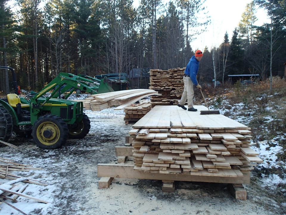 Workers at the NorthWoods Stewardship Center cut wood for a new bunkhouse in their demonstration forest and milled it on site. Photo courtesy of NorthWoods Stewardship Center.