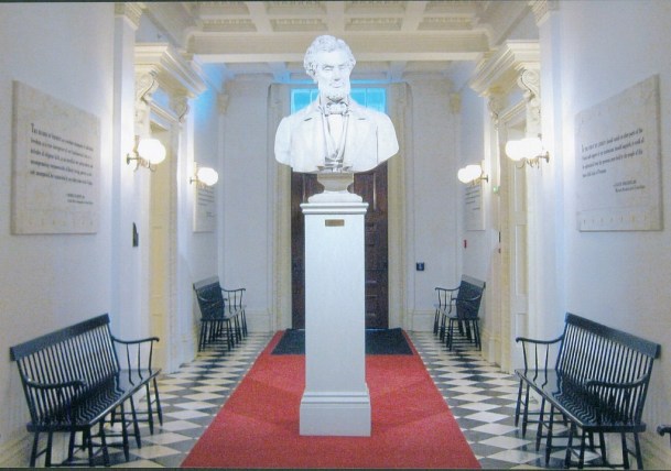 The commission appointed by Gov. Mortimer Proctor that decided to remove the Civil War tintype portraits lining the corridor opposite the front door of the Statehouse chose to install in their place quotations that conveyed Vermont's character and ideals. Larkin Mead, raised in Brattleboro, completed this sculpture of martyred President Abraham Lincoln as a study for a larger work. Mead's widow donated the bust to the state in 1910. It formed a perfect focal point for the new Hall of Inscriptions. Photo by Nancy Graff