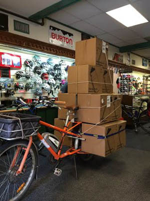 Be careful when you load your cargo bike that it will fit through the front door, in this case the door of Burrow's Bike Shop. Photo courtesy of Dave Cohen