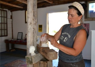 An artist to her core, Thea Alvin has many other pursuits besides creating giant stone sculptures, including working with modeling clay, above, in her studio. Photo by Andrew Nemethy