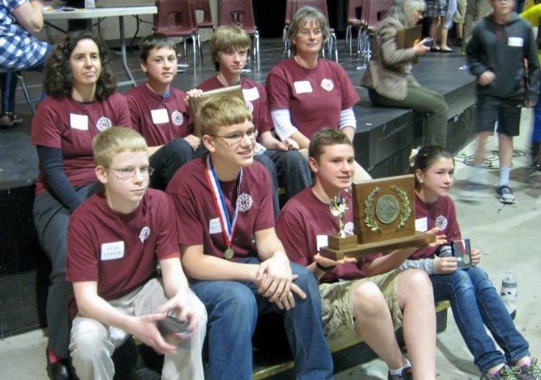 Harry Schukei, holds BFA Fairfax’s team trophy after the 2014 Vermont Principals’ Geography State Championship on May 10. Schukei and Ryan Parker, front row, far left, aced their questions, which covered everything from geology to world currencies. Photo by Nancy Graff