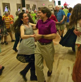 Two partners dance to the tunes of Ti’ Acadie, a lively Maine group, at the Grange hall in Montpelier. Photo by Dirk Van Susteren