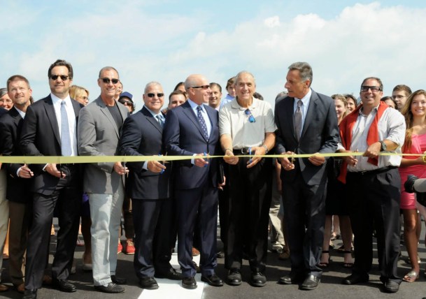 Dignitaries cut the ribbon on the redeveloped Morrisville-Stowe Airport on Tuesday. Photo by Hilary Niles/VTDigger