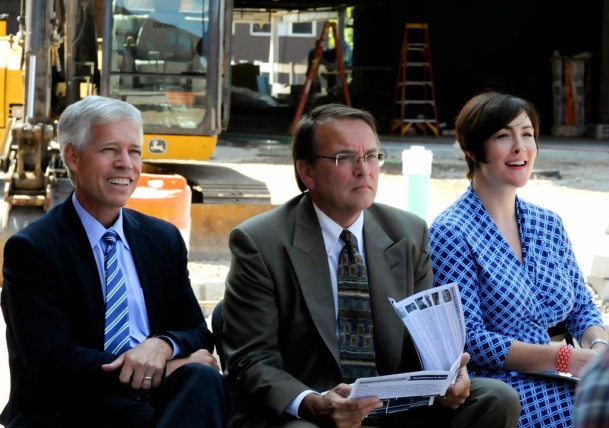 Montpelier Mayor John Hollar (left), Barre Mayor Thom Lauzon and Noelle MacKay, commissioner of the Department of Housing and Community Development, listen at a press conference on the awarding of state tax credits for development projects. Photo by Hilary Niles/VTDigger.org