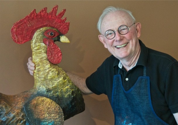 Warren Kimble, with “Rooster,” a plaster of paris creation that stands resolutely in the artist’s home in Brandon. Photo by Dirk Van Susteren