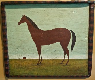 Many of Warren Kimble’s folk art paintings feature farm animals, and this one of a horse, recently titled “It’s a Long Way Home,” hangs on the wall of his studio in Brandon. Photo by Dirk Van Susteren