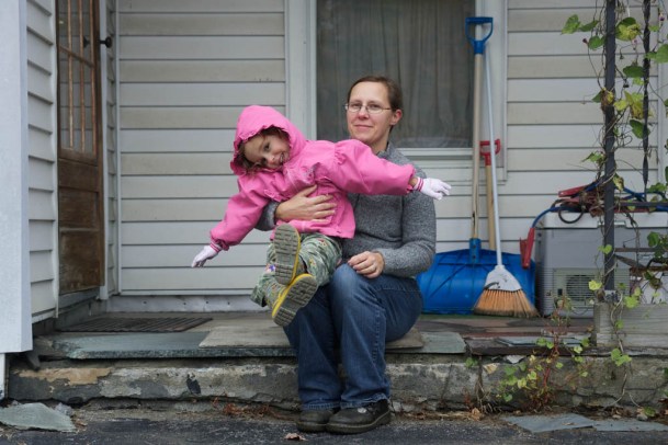 Brandy Ofciarcik-Perez and her daughter, Julie, sit on the step of her Graniteville home. Photo by John Herrick/VDigger  